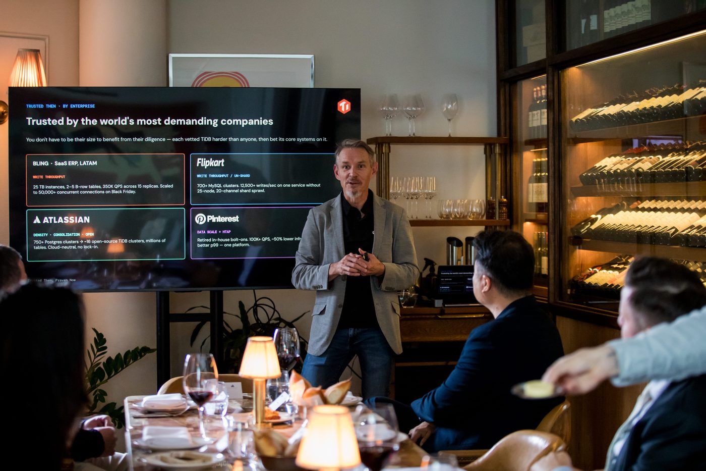 A TiDB speaker presenting to the table